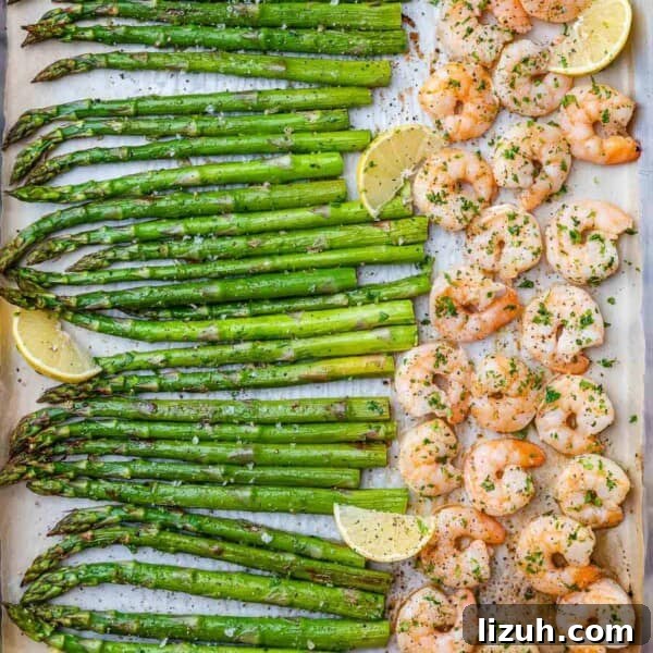 Crispy Parmesan-Roasted Asparagus — Oven-Baked Recipe 10 top view sheet pan of shrimp and asparagus