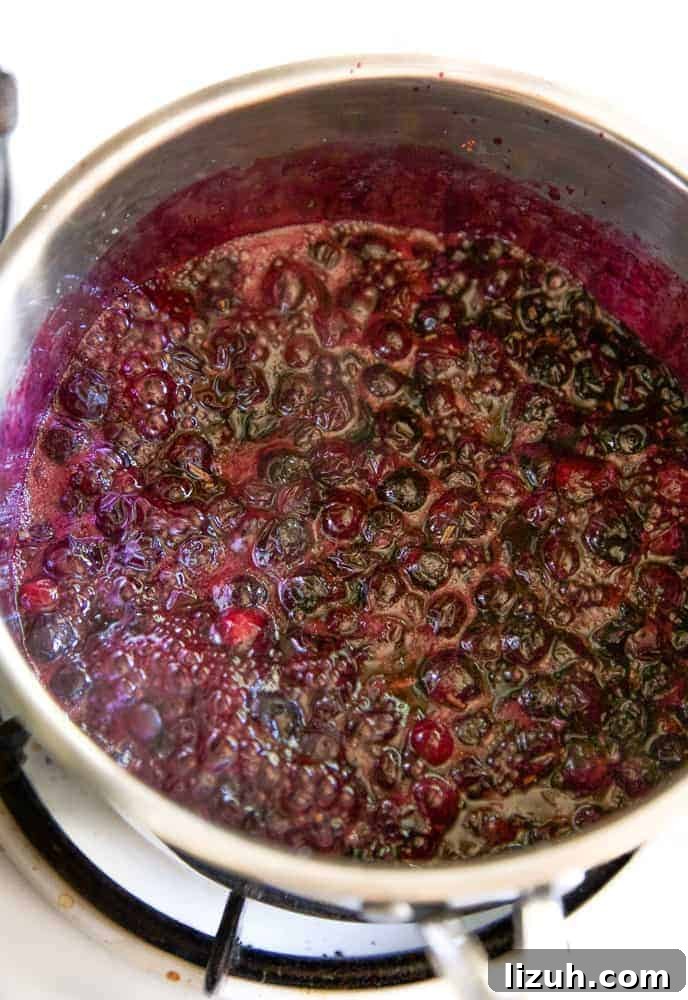 Blueberry Bourbon Glazed Baby Back Ribs Recipe 4 blueberry bourbon bbq sauce simmering in a pot