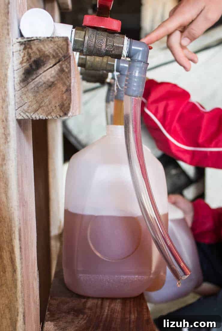 Filling the gallon sized jugs with plastic tubes.