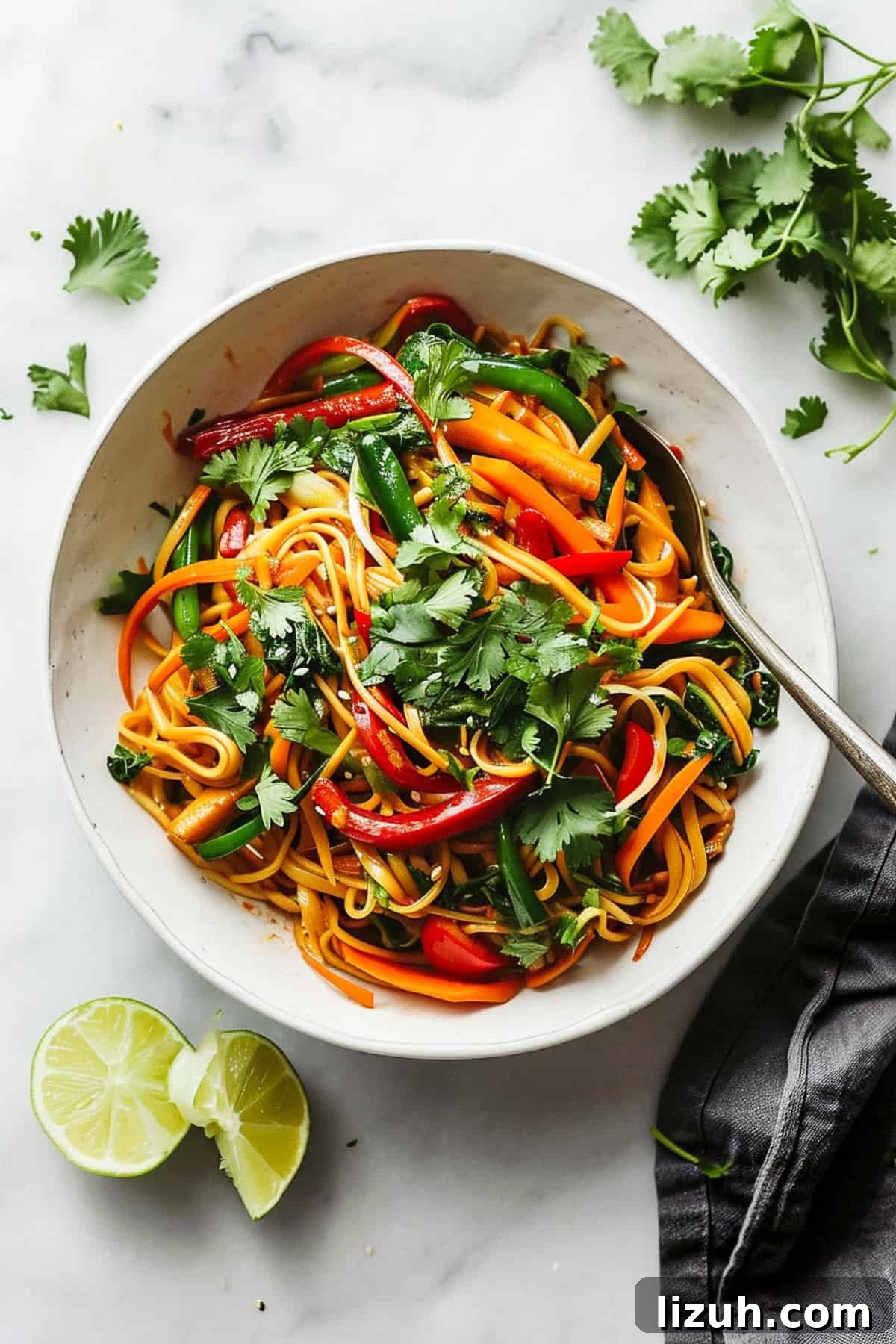 15 Minute vegetable noodle stir fry in a white bowl.