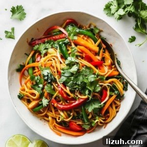 15 Minute vegetable noodle stir fry in a white bowl.