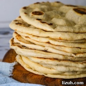 13 Must-Try Thermomix Sourdough Recipes You Can Make Today 18 Sourdough flatbreads on wooden board