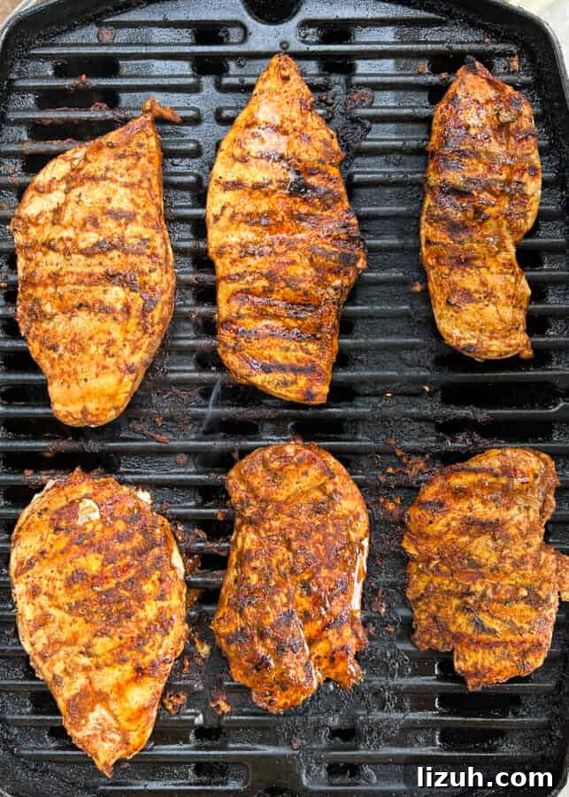 Easy Pollo Asado {Mexican Grilled or Roasted Chicken} being cooked on the grill