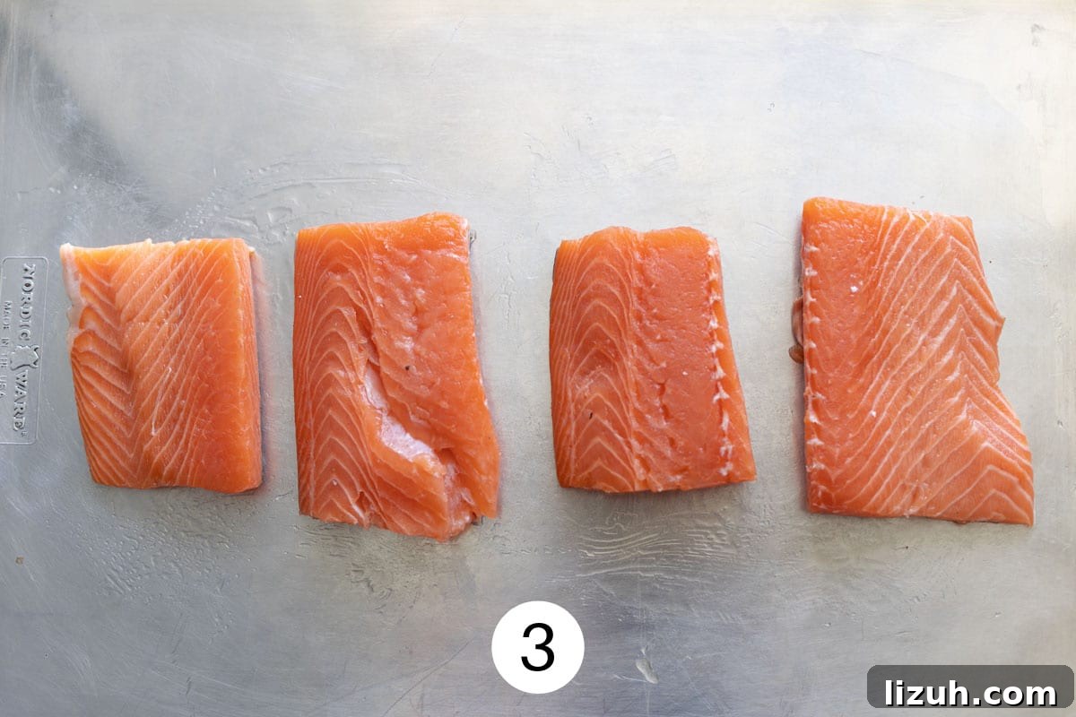 Step three: laying salmon on the sheet pan. 