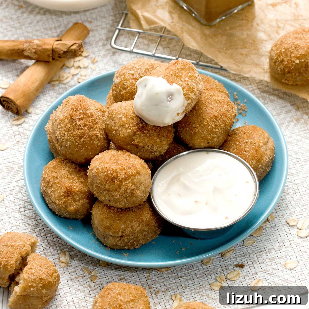 A plate with gluten-free cinnamon pretzel bites with greek yogurt cream cheese dip.