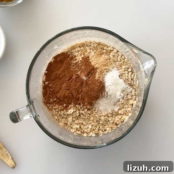Adding the dry ingredients to the mixing bowl.