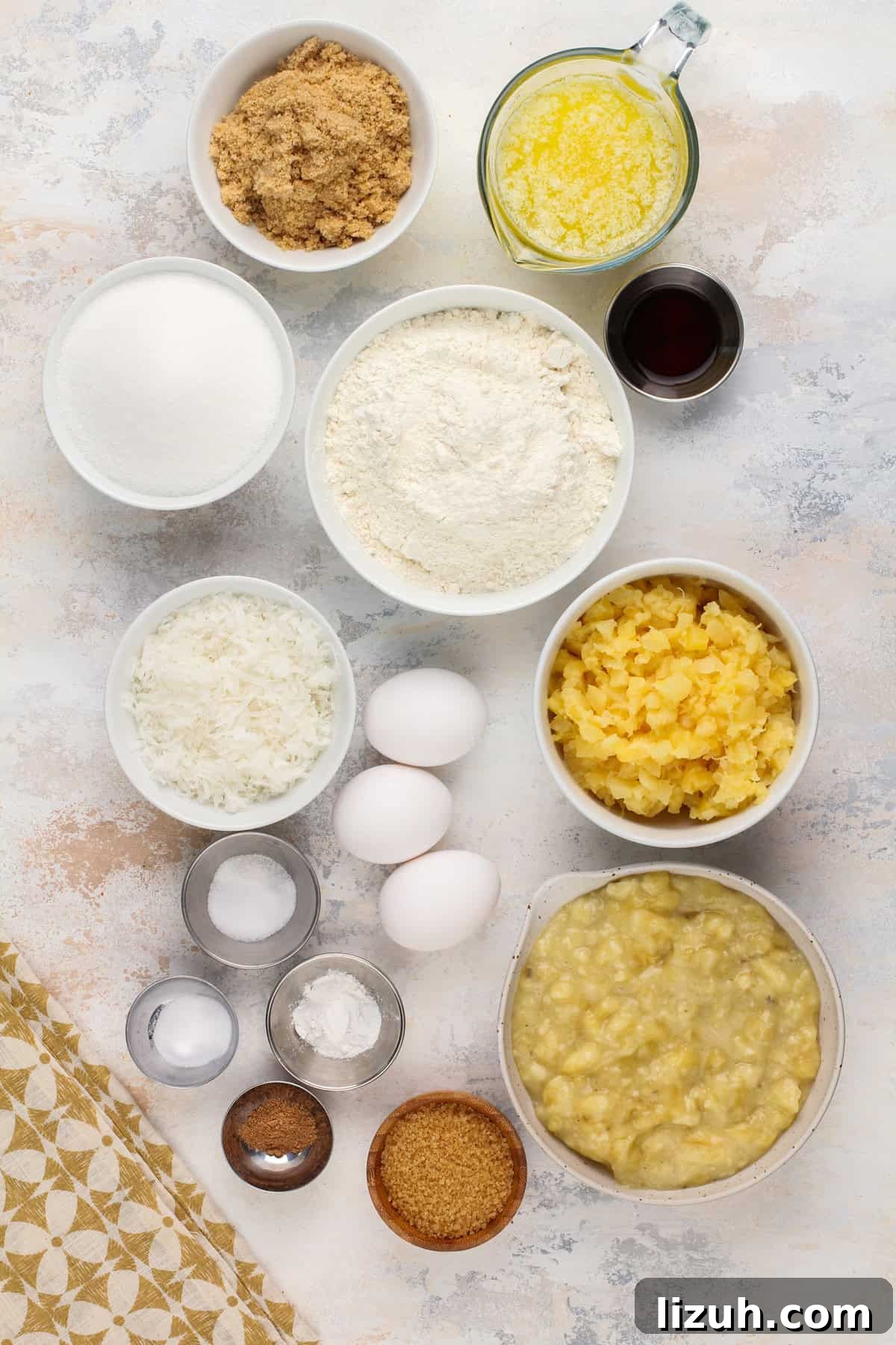 Ingredients for pineapple banana bread arranged on a countertop.