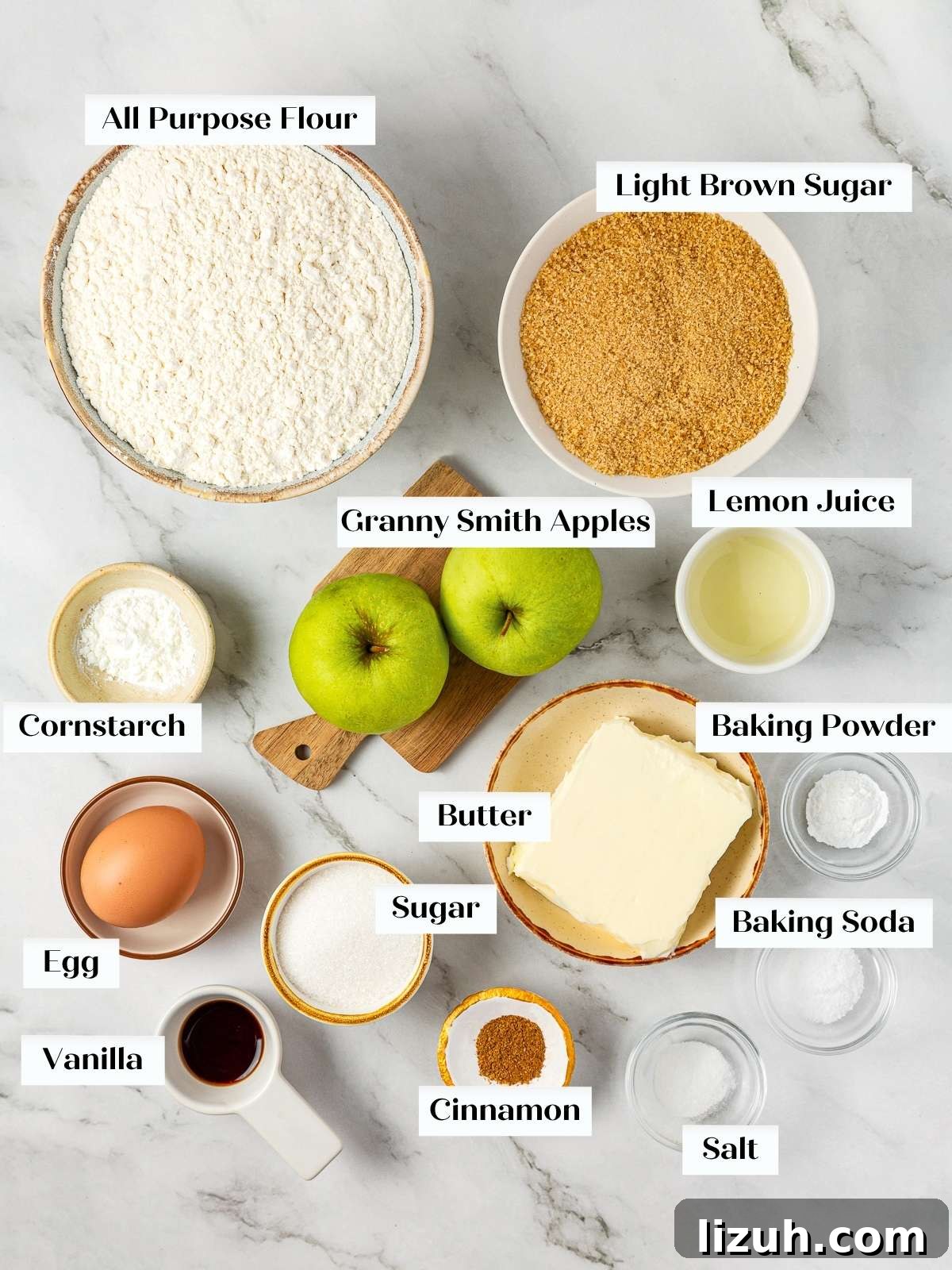Apple Pie Cookie Recipe: Crispy Cinnamon Apple Jam Cookies 4 Baking ingredients for apple pie cookies arranged on a kitchen counter, including apples, flour, and butter.