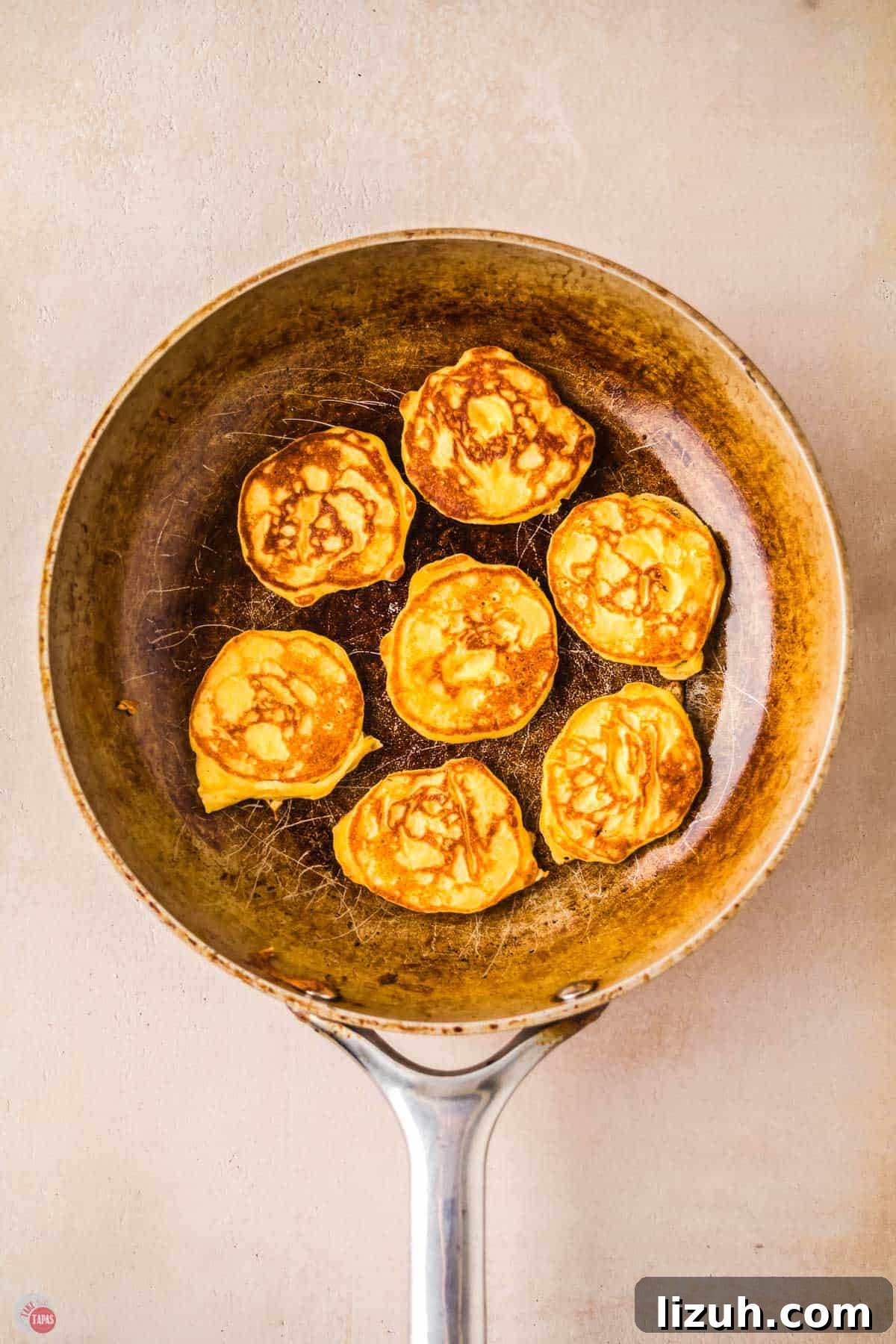 mini pancakes in a skillet