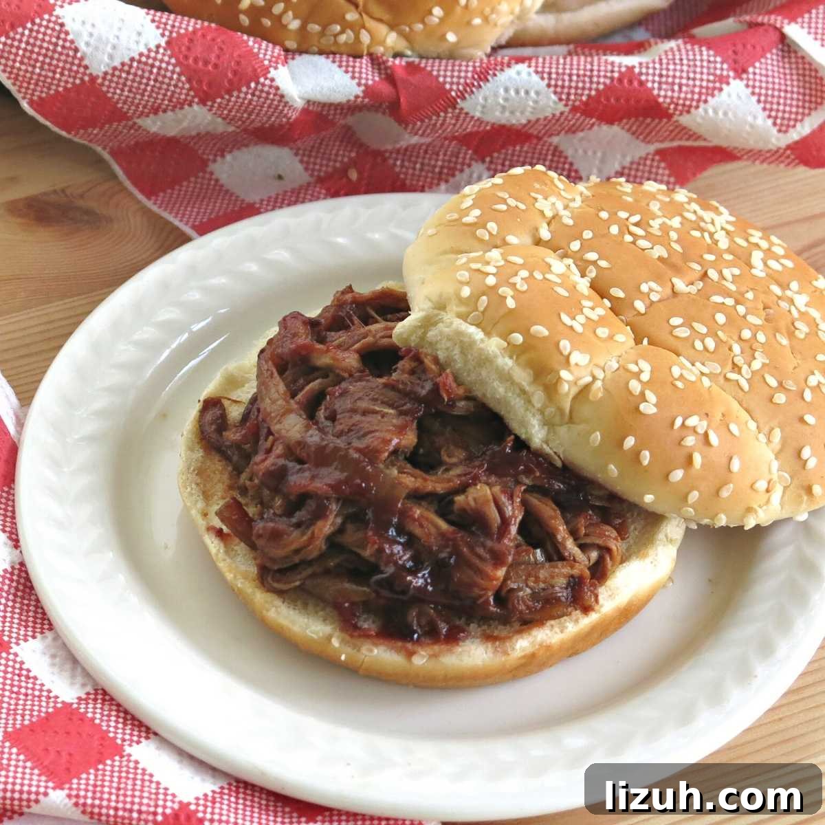 Slow Cooker Pulled Pork Tenderloin with Blackberry BBQ Sauce 2 Slow cooker pulled pork tenderloin in a blackberry bbq sauce on a bun.