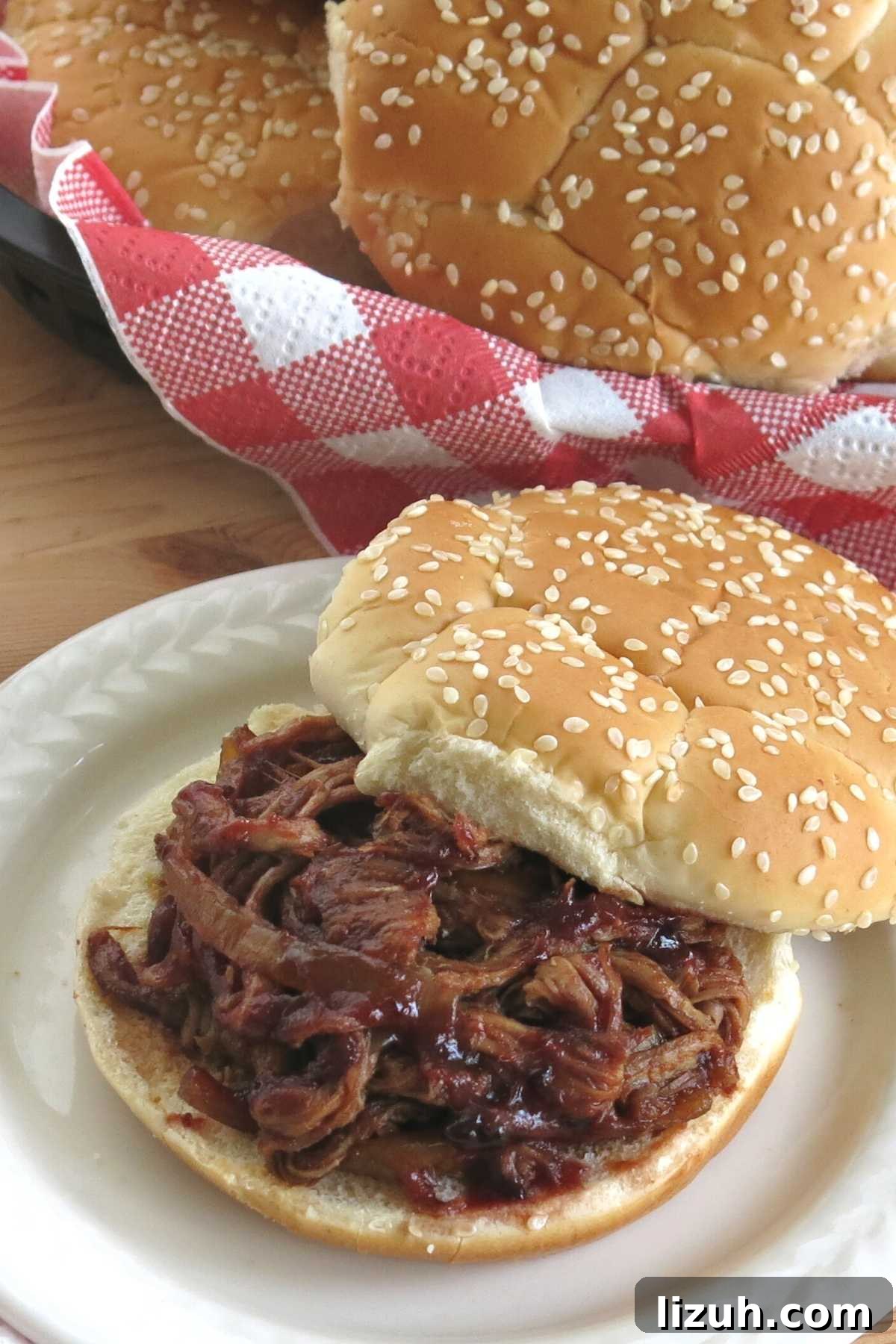 Slow Cooker Pulled Pork Tenderloin with Blackberry BBQ Sauce 5 Crock-pot pulled pork tenderloin on a bun.