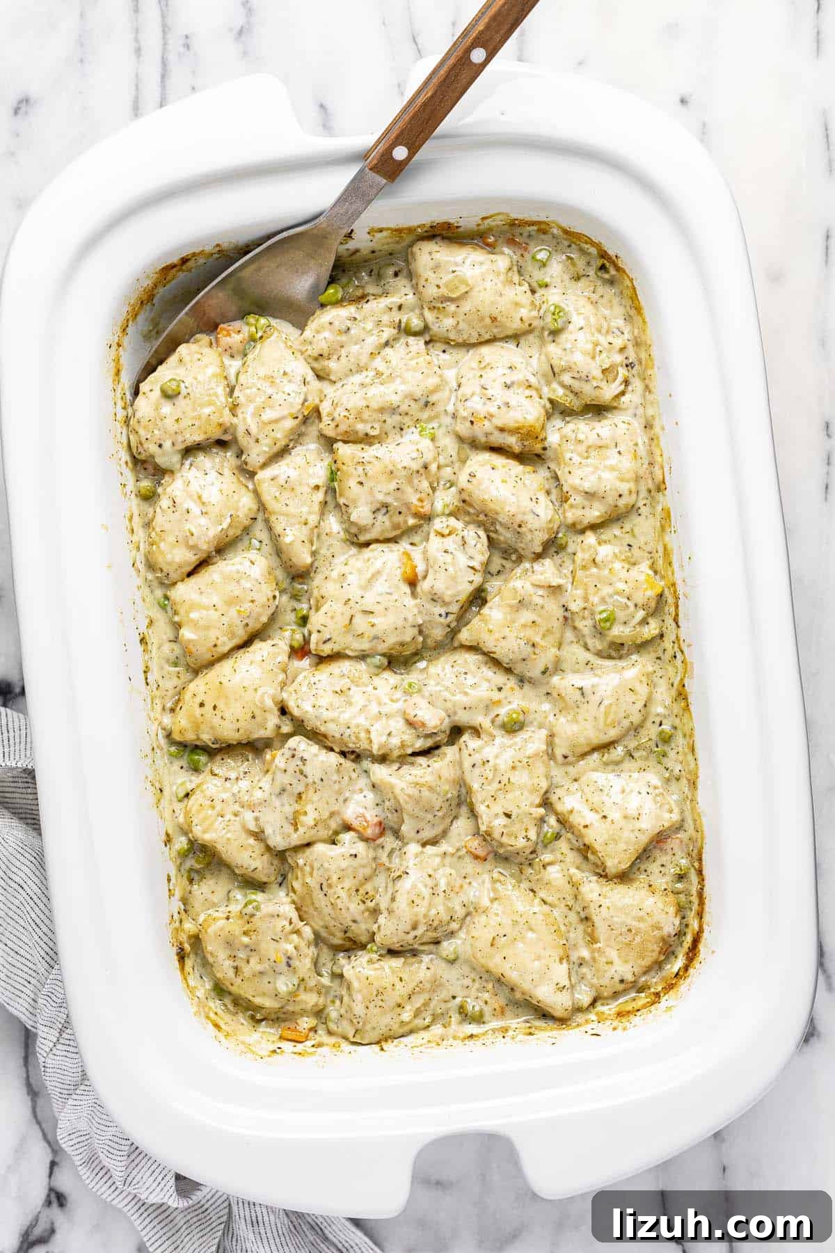 Slow Cooker Chicken and Dumplings: Comforting One-Pot Recipe 8 Homemade slow cooker chicken and dumplings in a crock pot.
