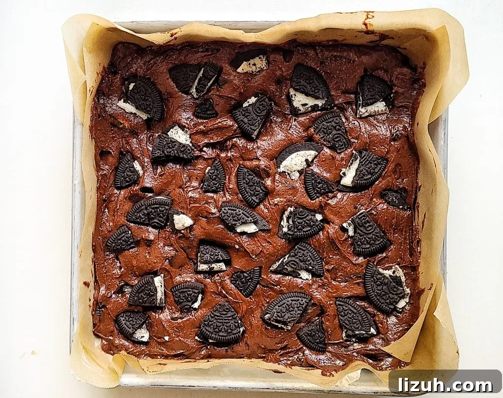 Chewy Oreo-Stuffed Brownies: Ultimate Chocolate Cookie Treat 6 oreo brownie batter ready for the oven
