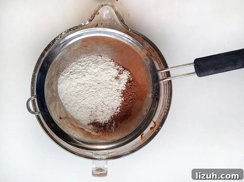 Chewy Oreo-Stuffed Brownies: Ultimate Chocolate Cookie Treat 4 sift in flour, salt, and cocoa powder