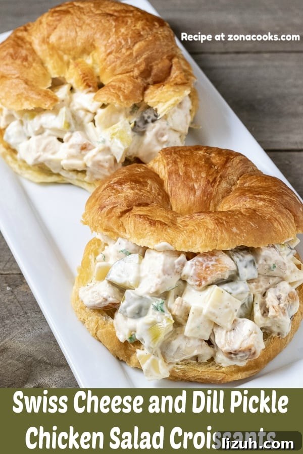 Dill Pickle Chicken Salad Sandwich with Swiss Cheese 2 a graphic with two swiss cheese and dill pickle chicken salad croissant sandwiches on a platter.