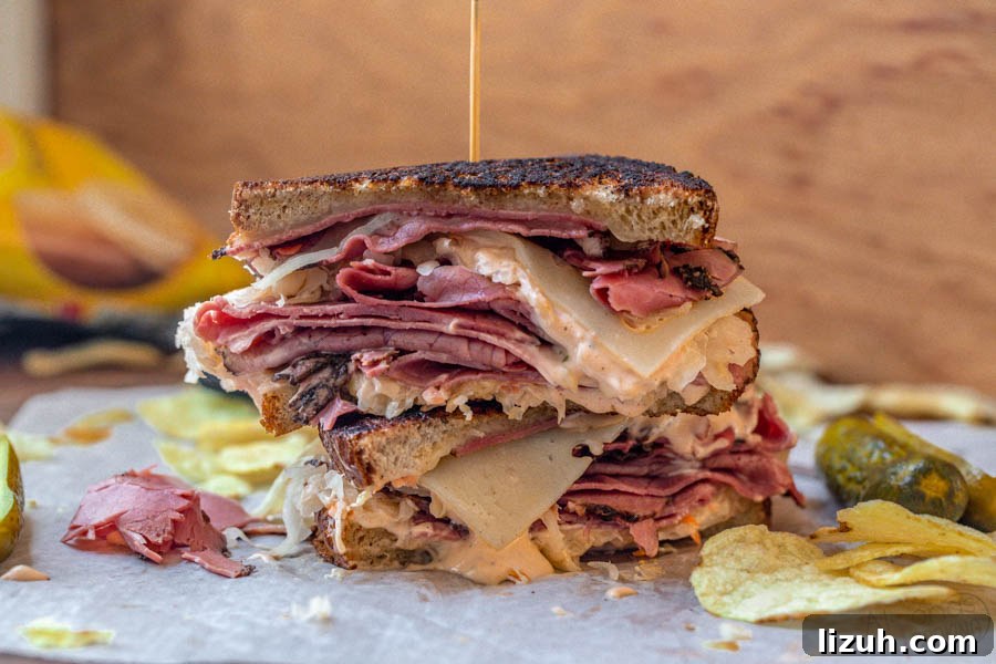 prepared Reuben sandwich made with pastrami, swiss cheese, thousand island, sauerkraut and rye bread