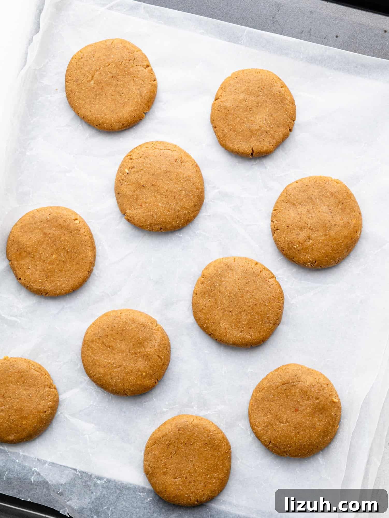 No bake peanut butter cookies on a sheet of parchment paper.