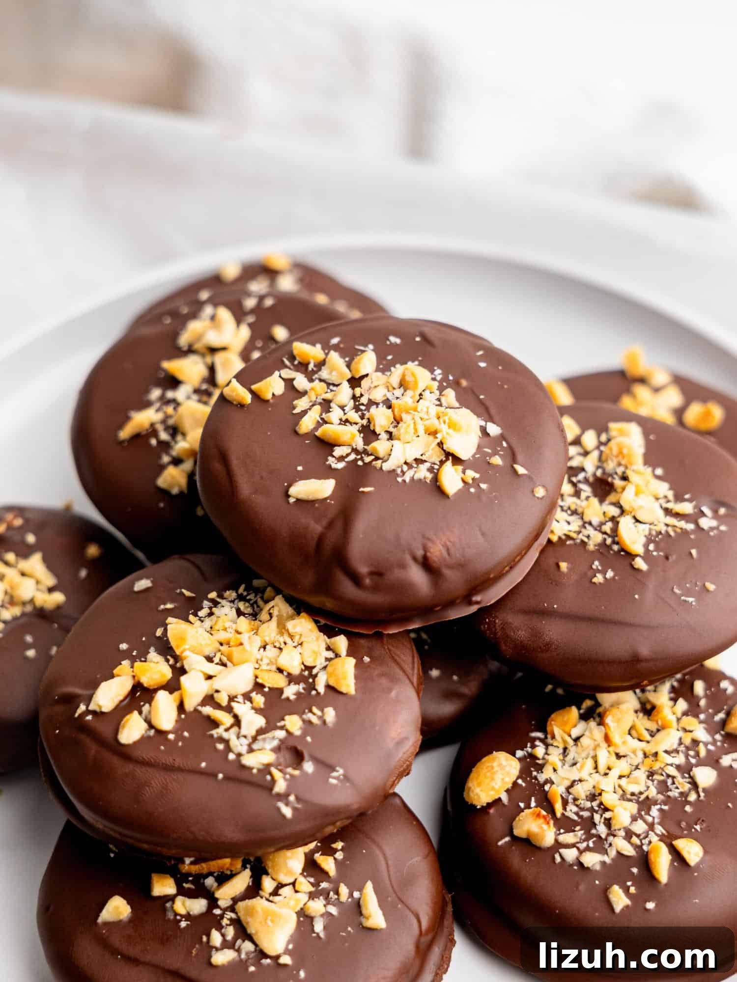 No bake peanut butter cookies on a white plate.