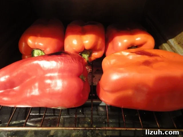 Red Bell Peppers Being Roasted In The Toaster Oven