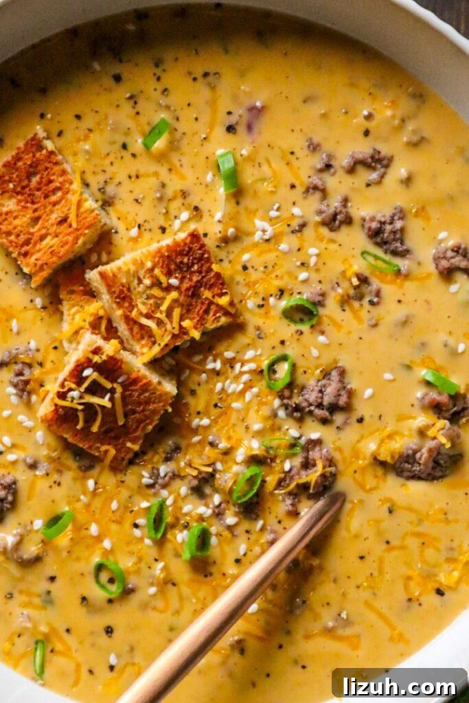 One-Pot Creamy Big Mac Cheeseburger Soup Recipe 3 Big Mac Cheeseburger Soup in a bowl with melted Velveeta and pickle relish