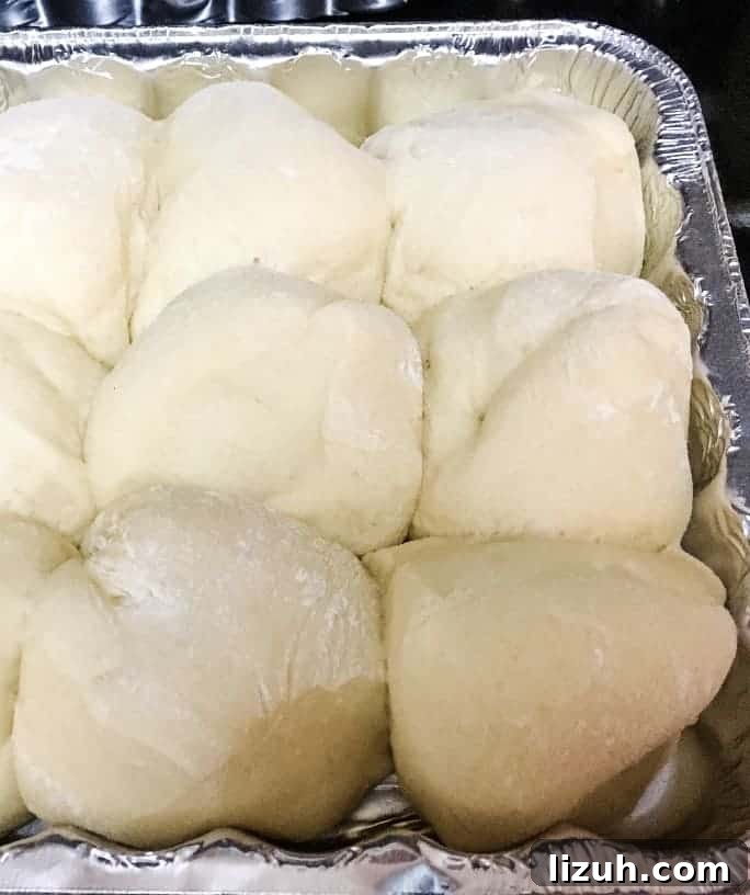 aluminum pan of unbaked dough for dinner rolls