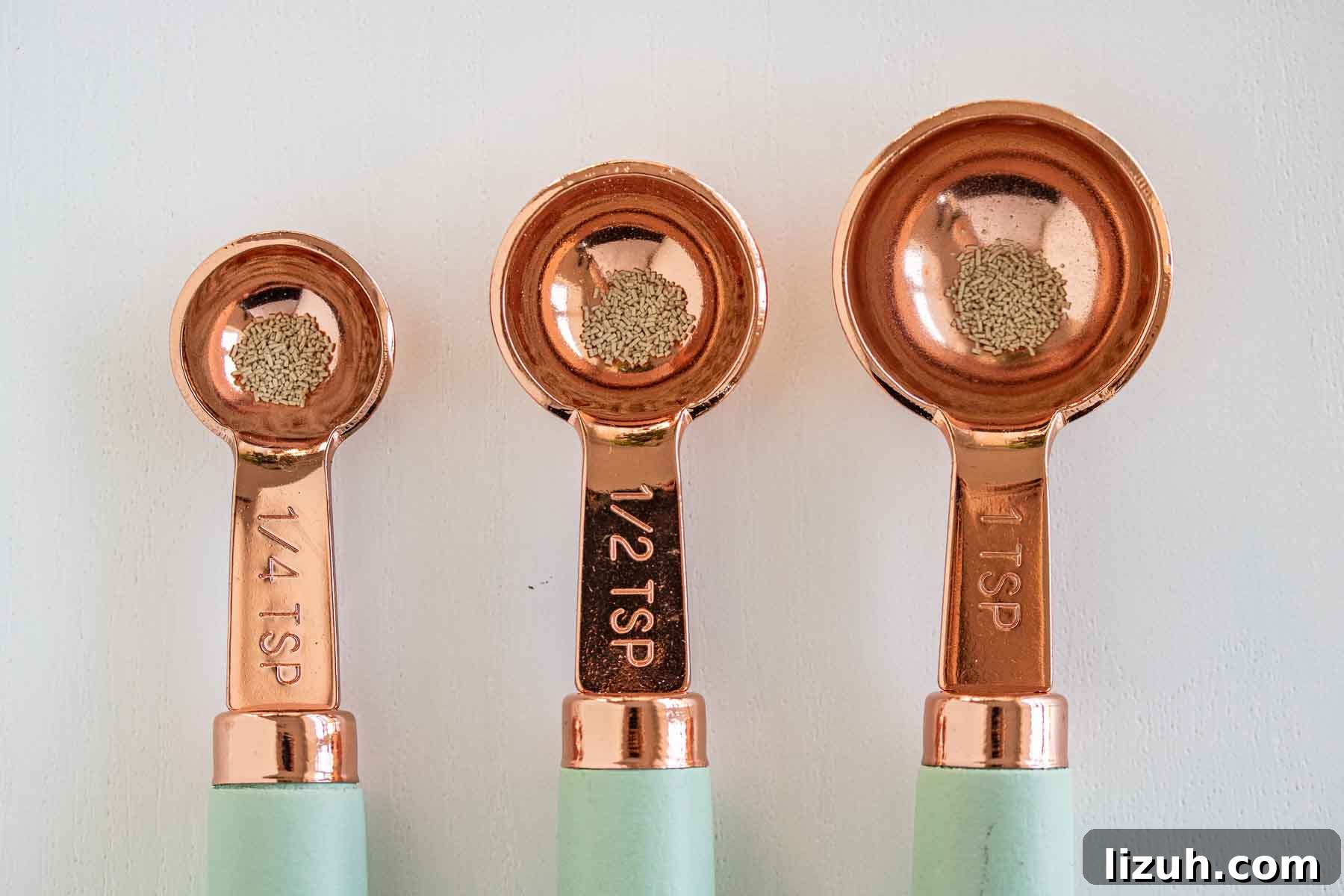 Make a Poolish Starter for Perfect Bread and Pizza Dough 4 3 measuring spoons with 2 grams of dry yeast.