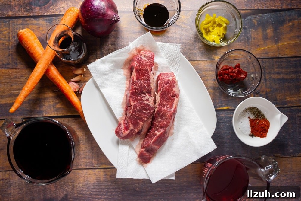 boneless short ribs with ingredients for a braise around it.