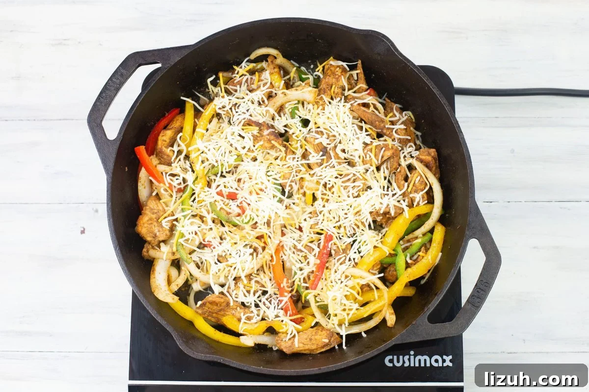 A skillet filled with the ingredients to make chicken fajitas for dinner in less than 30 minutes.