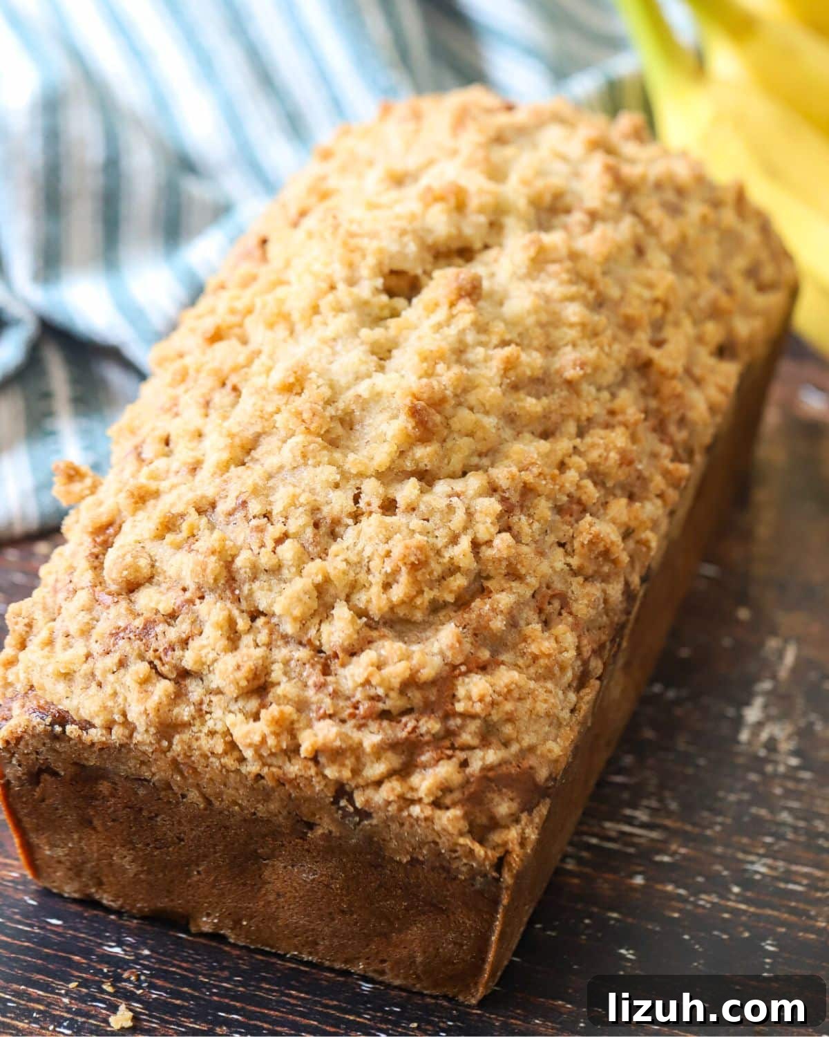 Moist Banana Bread with Crunchy Streusel Topping 11 Whole loaf of baked banana bread.