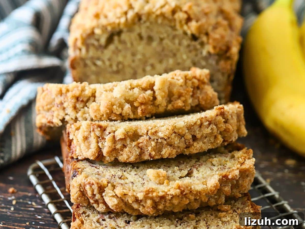 Moist Banana Bread with Crunchy Streusel Topping 3 Four slices of banana bread.