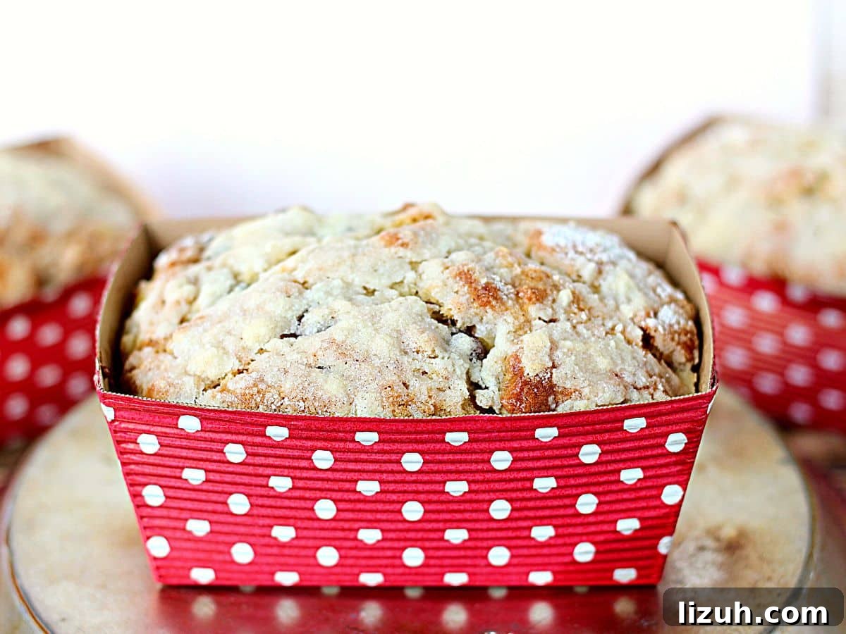 Moist Banana Bread with Crunchy Streusel Topping 5 Small loaf pan with baked banana bread inside.
