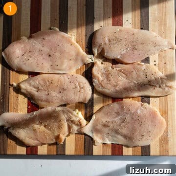 Classic Chicken Piccata Recipe: Lemon Butter Capers Guide 4 Tenderized chicken breast seasoned with salt and pepper on a cutting board.