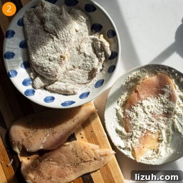 Classic Chicken Piccata Recipe: Lemon Butter Capers Guide 5 Dredging chicken breast in flour on a plate.