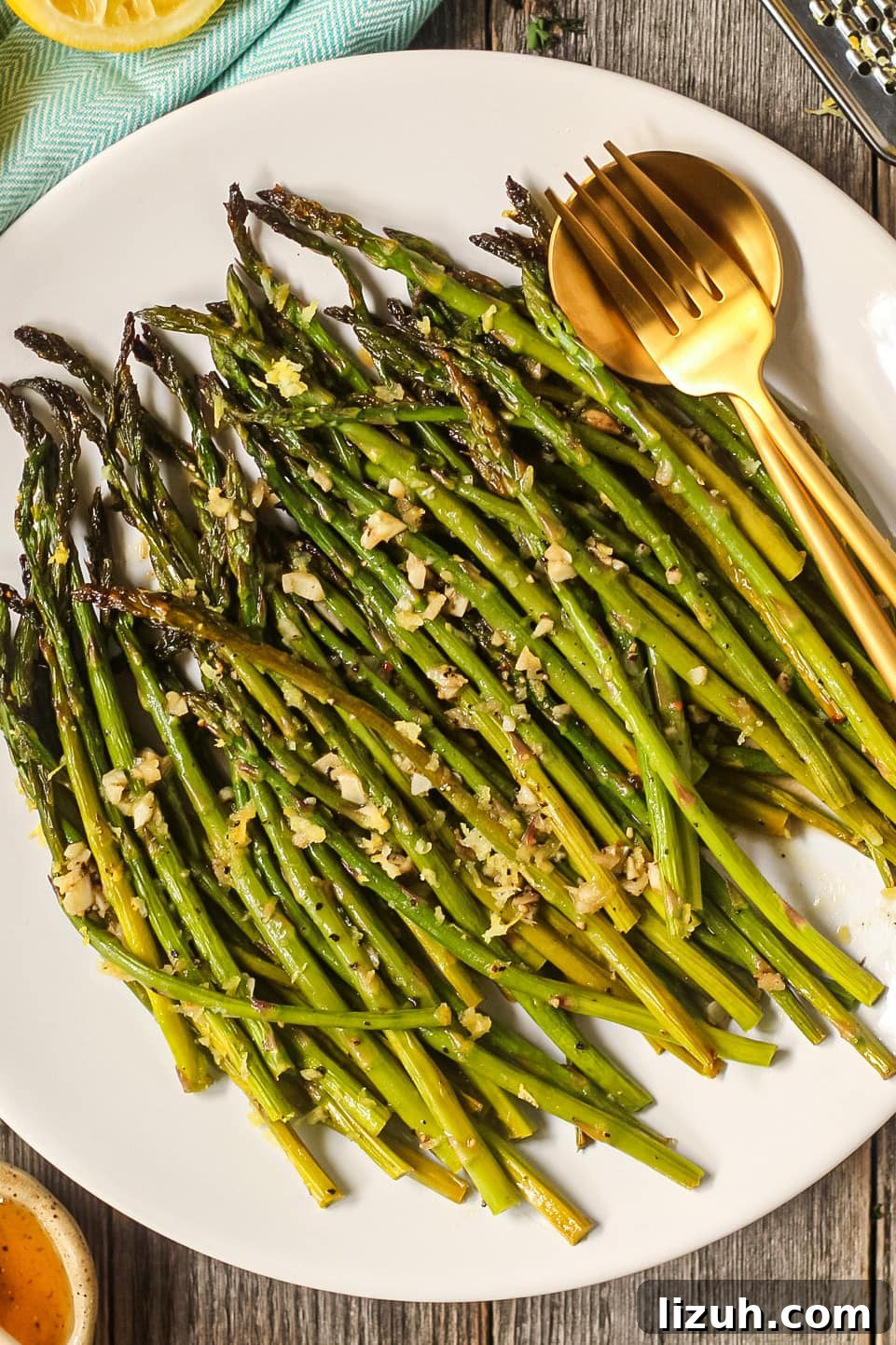 honey lemon butter roasted asparagus on a white plate