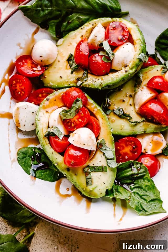 Caprese-Stuffed Avocados: Fresh Tomato, Mozzarella & Basil Recipe 3 Caprese Stuffed Avocados on a plate