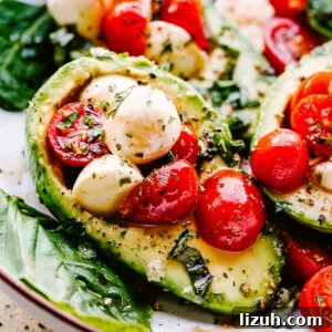 Caprese-Stuffed Avocados: Fresh Tomato, Mozzarella & Basil Recipe 6 Caprese Stuffed Avocados served on a plate