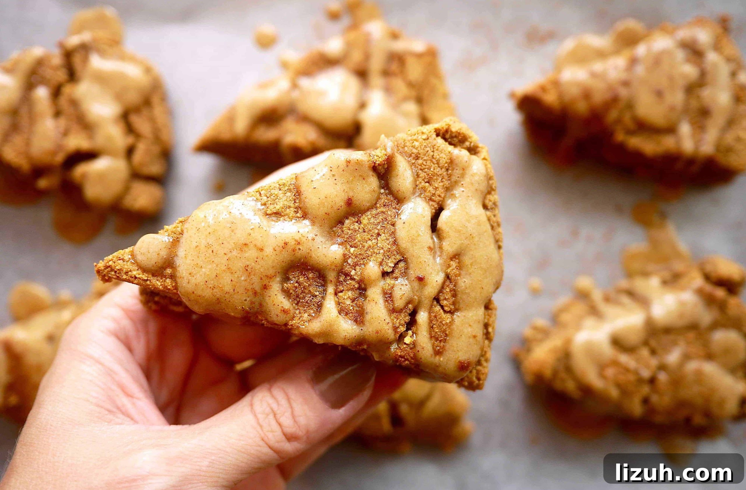 Paleo Pumpkin Scones with frosting drizzled on top.