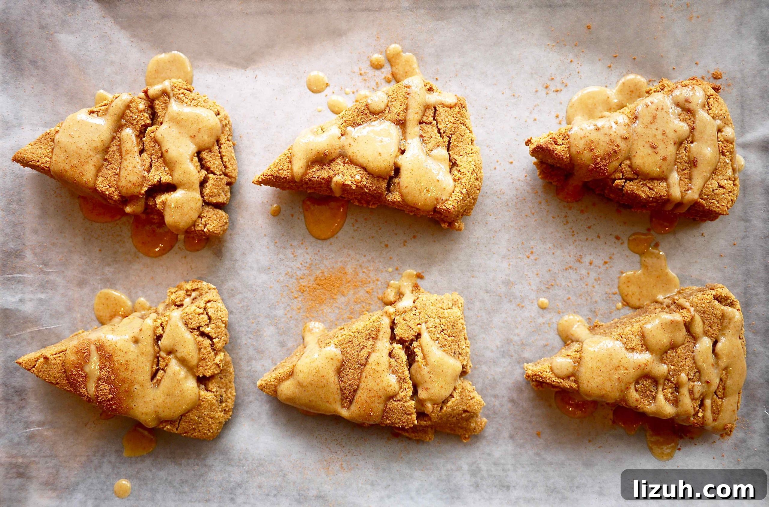 Healthy pumpkin scones on a cookie sheet.