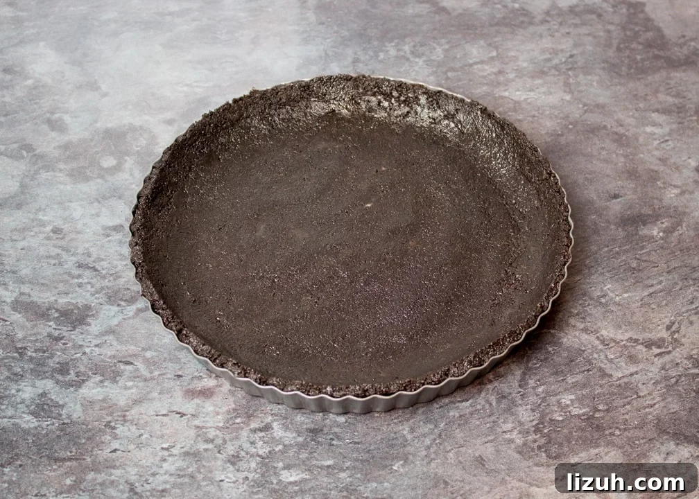Halloween Chocolate Tart with Bloody Spiderweb Decoration 6 Oreo biscuit crumbs pressed into a fluted tin