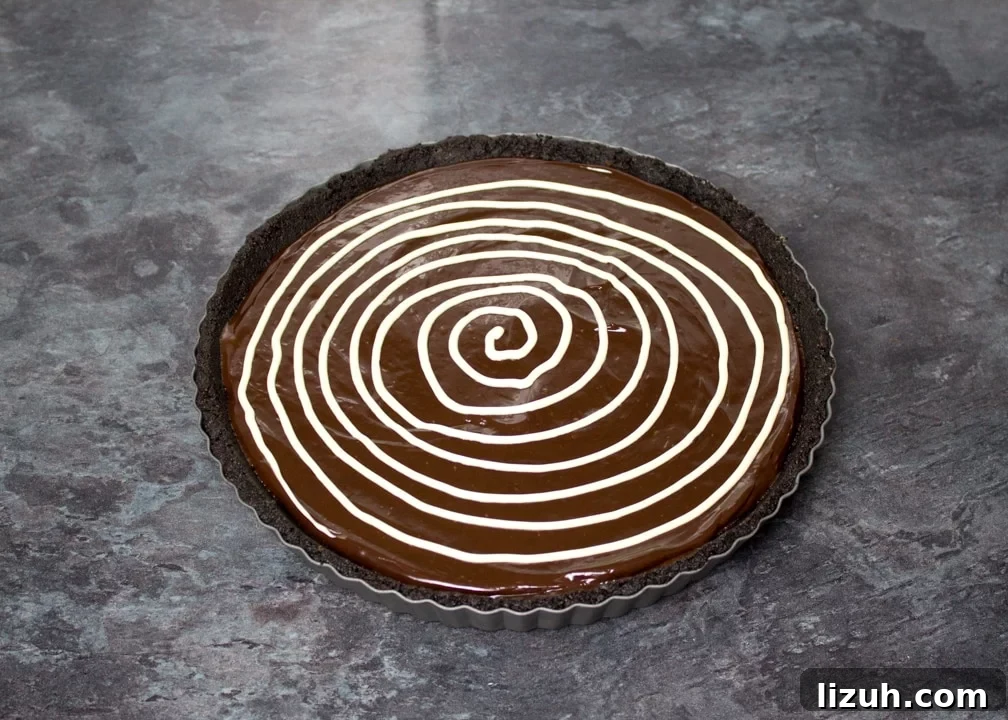 Halloween Chocolate Tart with Bloody Spiderweb Decoration 10 White chocolate spiral piped over a chocolate tart