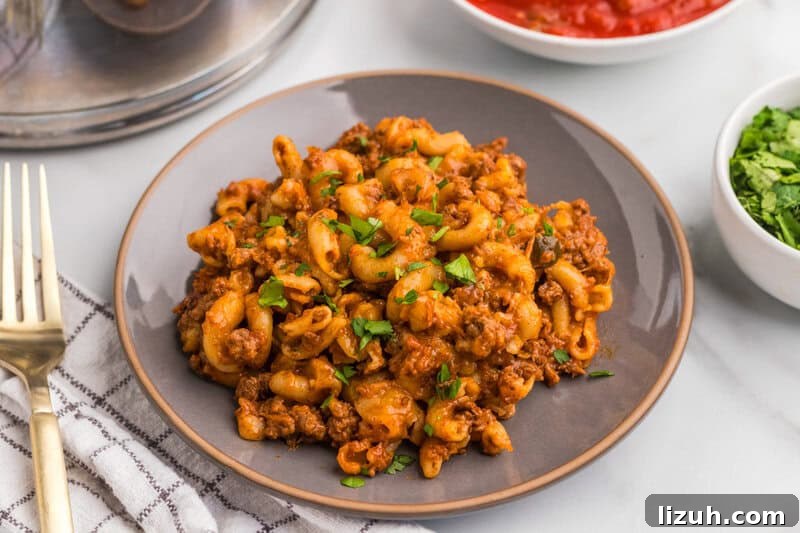 One Pan Taco Pasta served on a grey plate.