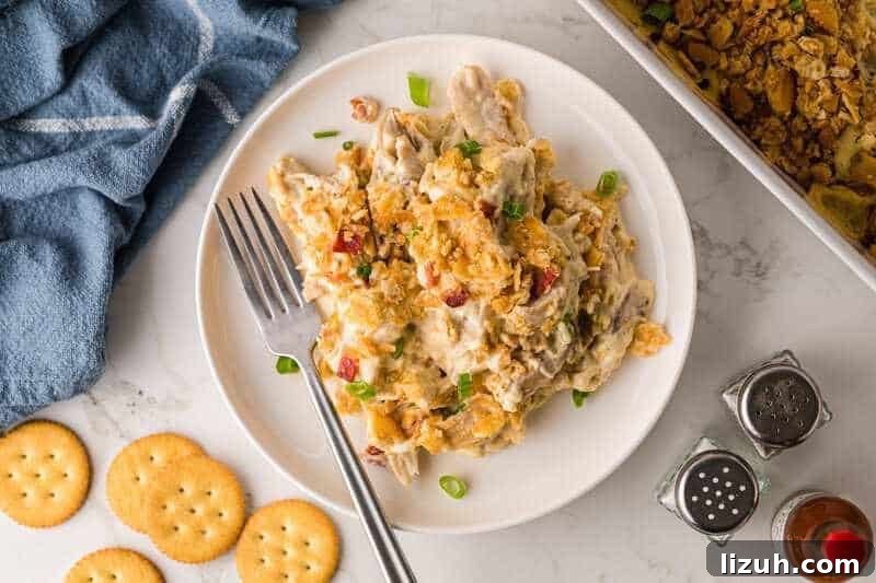 Million Dollar Chicken Casserole served on a white plate.
