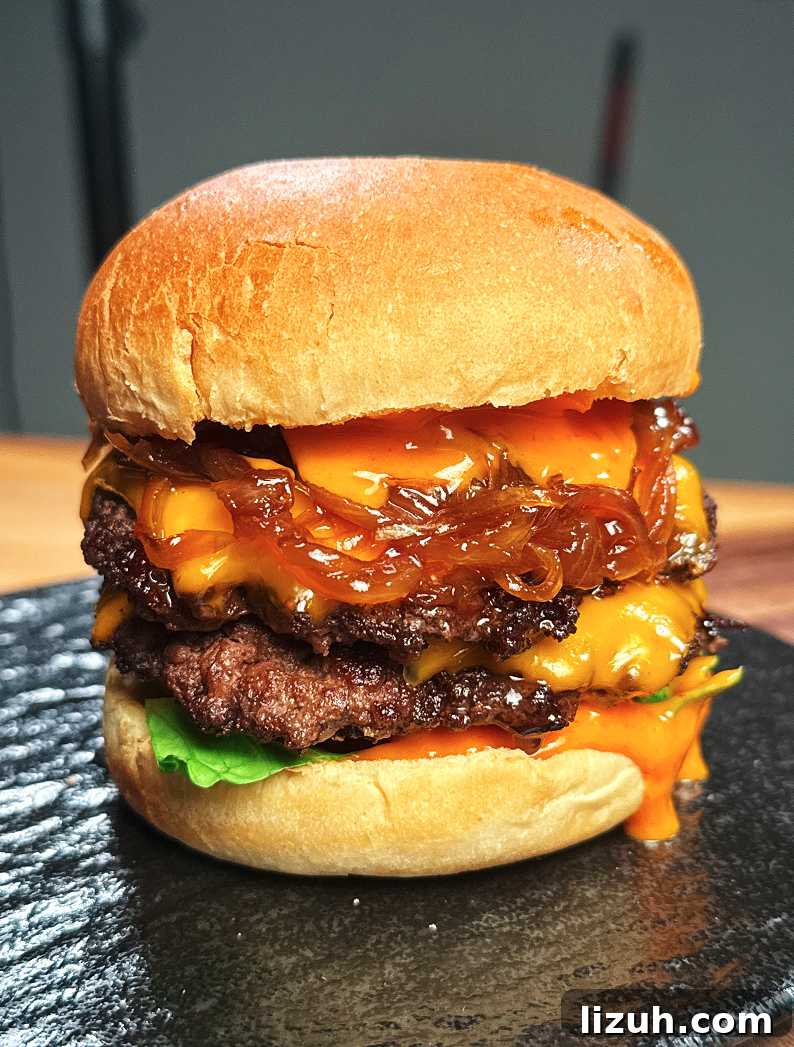 How to Make a Juicy Smash Burger at Home 2 Stacking caramelized onions, cheesy patties, and spicy mayo inside toasted burger buns, bringing together all the rich layers of the Asian Smash Burger.