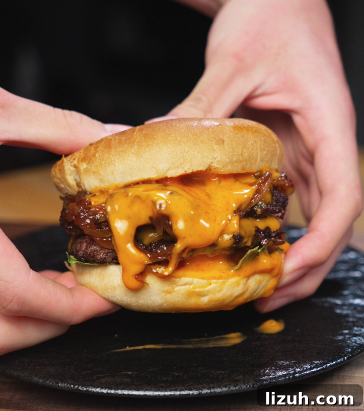 How to Make a Juicy Smash Burger at Home 3 Stacking caramelized onions, cheesy patties, and spicy mayo inside toasted burger buns, bringing together all the rich layers of the Asian Smash Burger.