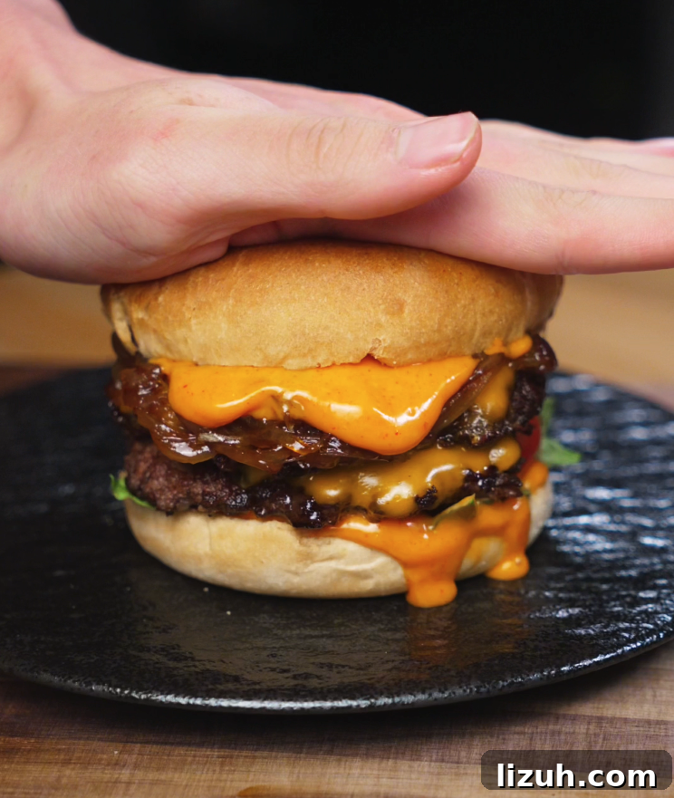 How to Make a Juicy Smash Burger at Home 7 Sliced onions cooked with soy sauce, sesame oil, and sugar until jammy and golden, creating the sweet-savory topping for the Asian Smash Burger.
