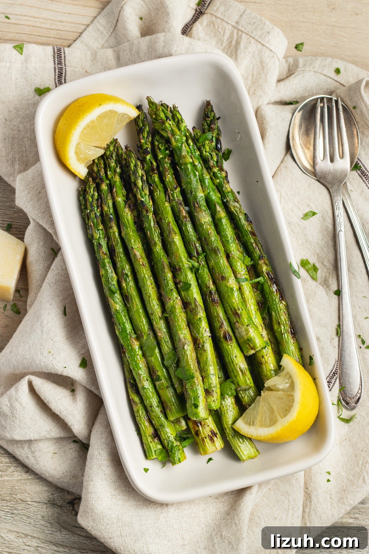 This is a picture of a dish filled with grilled asparagus.