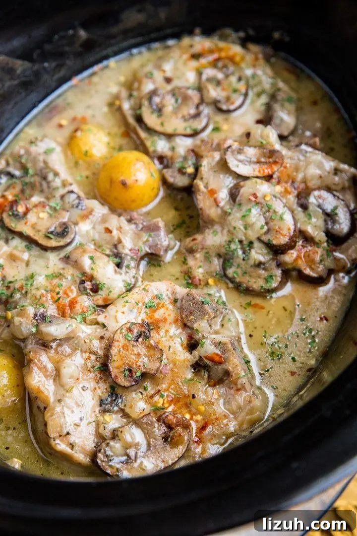 31 High-Protein Slow Cooker Recipes for Meal Prep and Weight Loss 17 crockpot pork chops with potatoes and mushrooms