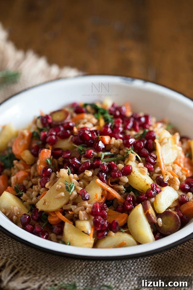 This farro carrot pomegranate salad is the perfect healthy side dish. It's packed full of vegetables and dressed with a simple squeeze of orange.