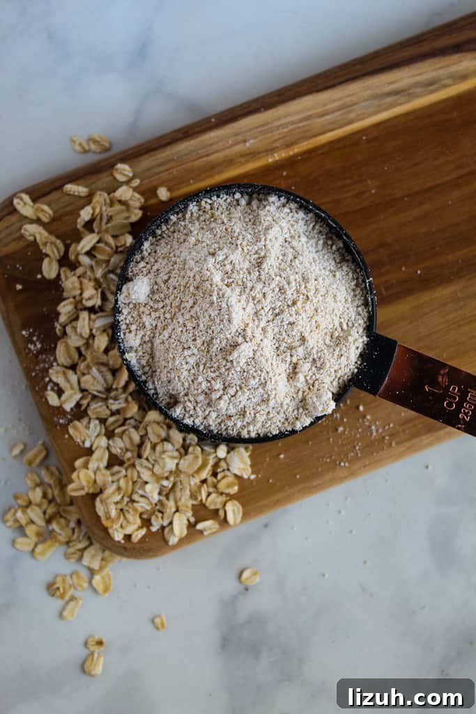 overhead shot of oat flour in a measuring cup