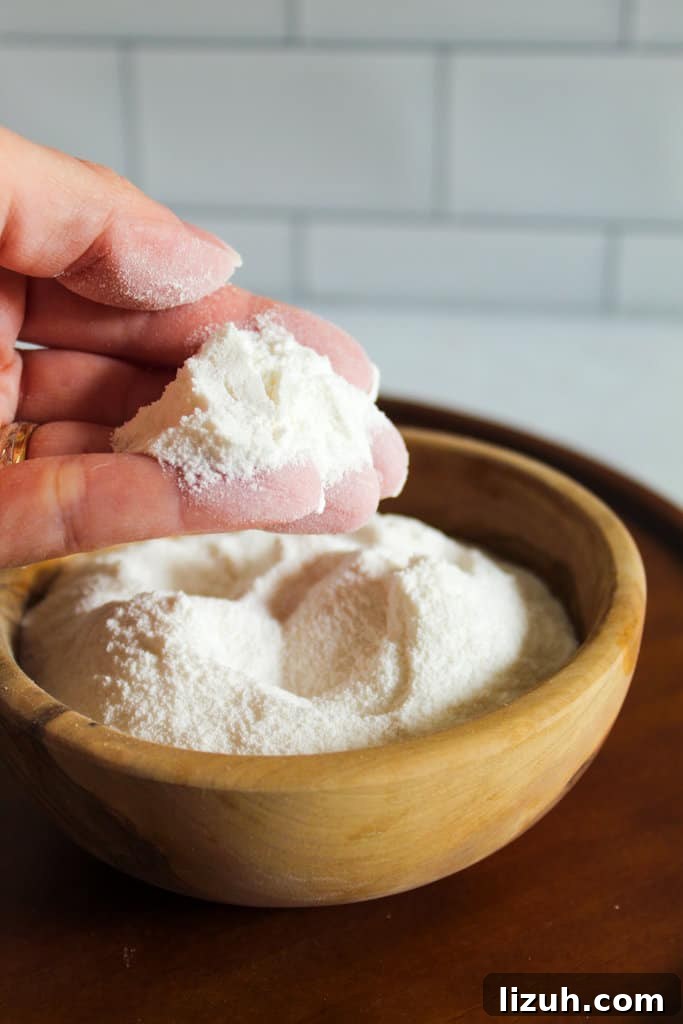 brown bowl of sweet rice flour with a hand holding.